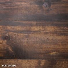 an old wooden table with a clock on it's face and the words tastemade written below