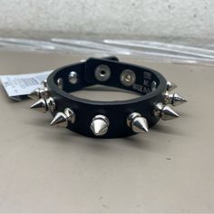 New Unisex Hot Topic Black Chrome Spiked Rocker Biker 3/4” Wide Bracelet Size M/L Adjustable Black Punk Wristband, Black Band Wristband For Concerts, Adjustable Punk Bracelets For Biker Events, Black Punk Bracelets For Festival, Adjustable Punk Bracelet For Streetwear, Adjustable Punk Bracelets For Streetwear, Edgy Band Bracelet For Concerts, Edgy Band Bracelet For Concert, Black Punk Festival Bracelets