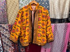 Handmade Item  Women's Phulkari Embroidered Jacket, Indian Handmade Embroidery Jacket, Winter Wear Jacket Coat, Summer Wear Jacket, Kutch Banjara Jacket Woman's jacket cotton Designer embroidery. This jacket was hand-made with vintage style phulkari embroidery by artisans from the nomadic desert tribe known as "Banjara ", in the Northern India. The Jacket is no closure pattern with Long Sleeves and Vibrant Color Item Detail - Material :- Cotton With Thread Work And Sequence. Length :- 24" Inches Festive Multicolor Embroidered Outerwear, Embroidered Festive Winter Outerwear, Festive Embroidered Winter Outerwear, Bohemian Long Sleeve Outerwear With Embroidered Border, Festive Winter Outerwear With Floral Embroidery, Festive Winter Floral Embroidery Outerwear, Traditional Embroidered Outerwear For Fall, Folk Style Embroidered Outerwear For Fall, Embroidered Outerwear For Festive Fall