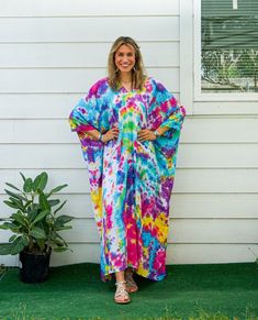 Add a touch of unique style to your wardrobe with our Hand-Dyed Kaftan Dress! This stunning dress is made from 100% breathable and comfy rayon fabric, ensuring maximum comfort all day long. Using our unique method, each dress is carefully hand dyed, resulting in a one-of-a- kind masterpiece. The intricate patterns and vibrant colors make this dress a true work of art. The kaftan dress comes in a versatile one size fits most (M-3XL), making it extremely comfortable for a wide range of body types. With a bust measurement of up to 60", you can feel confident that this dress will flatter your figure. The dress measures 55" in length and 45" in width, providing a loose and flowing fit that is both stylish and flattering. Featuring a trendy V-neck design and side slits, this slipover style dress Oversized Multicolor Dresses For Beach Season, Tie-dye Beachwear Kaftan For Festival, Tie Dye Kaftan For Festival Beachwear, Tie Dye Free Size Kaftan For Beach, Tie Dye Free Size Beach Kaftan, Beach Tie-dye Free Size Kaftan, Free Size Tie Dye Kaftan For Festival, Relaxed Fit Multicolor Kaftan For The Beach, Beach Hand-dyed Multicolor Dresses