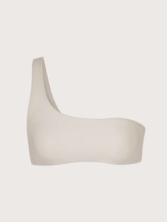 An artful take on a classic bikini top. The Anemos One-Shoulder Bikini Top features an asymmetric silhouette with a curved neckline and slender shoulder strap. Style it with the Midi High-Cut Bottom for a day in the sun. Made in LA. Size + Fit Fits true to size Please reference Anemos Material + Care UV protected UPF 50+, fully lined Composition: 72% polyamide, 28% elastane Machine washable - ships with Anemos wash bag Made in Los Angeles Fitted One-shoulder Top With Built-in Bra, Fitted One Shoulder Top For Beach, Fitted Seamless One Shoulder Top With Asymmetrical Neckline, Fitted One-shoulder Top For Beachwear, Seamless Fitted One Shoulder Top With Asymmetrical Neckline, Fitted Seamless One-shoulder Top With Asymmetrical Neckline, Solid One-shoulder Seamless Swimwear, Seamless Solid One-shoulder Swimwear, Seamless One Shoulder Top With Asymmetrical Neckline