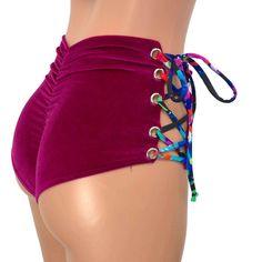 Our classic high waist hot pants with scrunch ruching detail in back to offer a "cheekier" look AND Lace-up sides! These hot pants are made of stretchy fuchsia velvet with splatter print ties and sit high on your natural waist. The lace-up sides make these more adjustable to fit you even better. Wear as a bikini bathing suit bottom, panties, rave shorts, etc. They have a built in liner and are made to be flattering to your figure. Fitted Tie-side Shorts For Beachwear, Beachwear Bottoms With Ruched Tie-sides, High Waist Fitted Swimwear With Drawstring, Fitted High Waist Swimwear With Drawstring, Fitted High Waist Drawstring Shorts, Swimming Bottoms With Ruched Sides And Tie-side Shape, Tie-side Swimming Bottoms With Ruched Sides, Tie-side Bottoms With Ruched Sides For Swimming, Fitted Tie-side Swimming Shorts