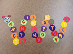 the letters are made up of different colored paper circles and numbers that spell out the word's name