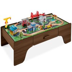 a toy train table with cars and trucks on it, sitting on a white background