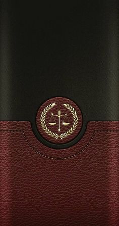 a red and black case with a gold emblem on it