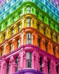 a multicolored building with many windows and balconies