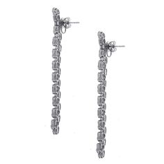 For Sale on 1stDibs - Material: 18k white gold Style: Drop earrings Diamond Details: Approximately 7.25ctw baguette cut diamonds. Diamonds are G in color and VS in clarity. Formal Platinum Diamond Earrings Baguette Cut, White Gold Baguette Diamond Earrings For Formal Occasions, Formal Baguette Cut Platinum Diamond Earrings, Silver Baguette Cut Diamond Earrings For Formal Occasions, White Gold Diamond Accent Baguette Earrings, White Gold Baguette Cut Diamond Earrings With Accents, Platinum Diamond Earrings With Baguette Diamonds For Formal Occasions, Platinum Diamond Earrings With Baguette Cut For Formal Occasions, Luxury Platinum Diamond Earrings With Baguette Diamonds