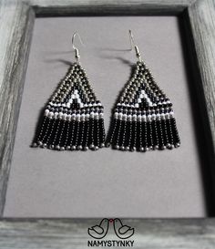 These gray beadwork gray earrings are made of high-quality Czech beads and strong synthetic thread. They are elegant, fashionable, and highly versatile, suitable for everyday wear. Features: Sterling silver components Color: gray, black, white Length (approximate): 6 cm (2.36 in) This item is currently in stock. You must be completely satisfied. If you find merchandise unsatisfactory for any reason, return it within 10 days and your money will be refunded without questions. These earrings in gol Gray Beaded Dangle Earrings, Handmade Gray Drop Earrings, Handmade Gray Dangle Earrings, Handmade Gray Beaded Earrings For Gift, Bohemian Gray Dangle Earrings, Handmade Gray Beaded Dangle Earrings, Fringe Beaded Earrings, Beadwork Earrings, Gray Earrings