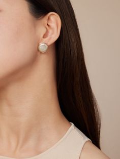 Indulge in elegance with our COCOKIM Pearl Stud Earrings, a testament to refined femininity and understated sophistication. Crafted to elevate your spring ensemble, these exquisite earrings exude a sense of high-end charm and individuality. Embrace a touch of luxury with this chic and unique accessory, perfect for those who appreciate timeless style with a contemporary twist. Metal: 14K Gold Filled Gemstone: Freshwater Pearl Diameter: 18mm(Contains Metal Parts) Elegant White Everyday Earrings, Elegant White Earrings With Polished Finish, Elegant Everyday Earrings, Geometric Series, Pearl Stud Earrings, Pearl Studs, Ear Studs, Accessories Unique, Timeless Style