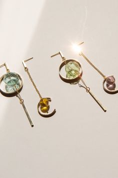 Minimalist, asymmetrical dangling earring with a statement-making hexagonal hollow glass bead that catches the light beautifully. Designed with 14k gold plated accessories.  Available in 2 colours: Teal/Yellow & Green/Pink Measurements: 3cm x 8.5cm / 2cm x 7.5cm For more minimalistic, glass bead designs, do check out our store listings! As all items are handmade, there may be imperfections, such as slight differences in colour and measurements. ------- - SHIPPING INFO -   A tracking number will Modern Glass Drop Earrings, Minimalist Glass Dangle Jewelry, Asymmetric Earrings, Bead Earring, Teal Yellow, Geometric Earrings, Sun Catcher, Earrings Photo, Bead Designs