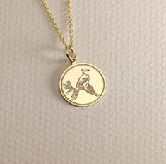 14K Real Solid Gold  blue jay necklace ● Material of pendant: Solid Gold 14k ( REAL GOLD ) ● Metal Stamp: 14L ( REAL GOLD ) ● The pendant is available in 6 sizes: - 14,0 mm / 0,55 inches ( Diameter ) In the photos - 15,3 mm / 0.60 inches ( Diameter ) - 16,5 mm / 0,65 inches ( Diameter ) - 19,1 mm / 0,75 inches ( Diameter ) - 21 mm / 0,82 inches ( Diameter ) - 23 mm / 0.90 inches ( Diameter ) ( In the photos the size is 14mm / 0.55 inches Diameter ) ( Jump Ring inner diameter: 4 mm ) ● Material O Round Necklace With Bird Design For Gift, Gold Necklace With Bird Design For Gift, Bird Design Necklace Gift, Bird Design Pendant Necklace For Gift, Bird Design Pendant Necklace Gift, Gold Pendant Necklace With Bird Design, Jay Blue, Yellow Gold Bird Design Pendant Jewelry, Bird Pendant Gold