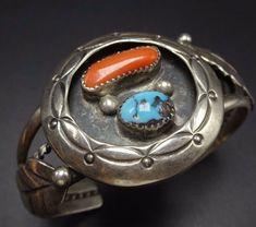 "VINTAGE NAVAJO BRACELET DESCRIPTION: This lovely cuff features a round, hand stamped shadowbox which reveals gorgeous specimens of turquoise and old red Mediterranean branch coral. Applied leaves frame the sides of the shadowbox. This bracelet will be a cherished addition to your collection of fine vintage Native American jewelry. MEASUREMENTS: Interior of the cuff measures 5 1/2\" with an additional 1 1/8\" slightly adjustable gap. Total circumference: 6 5/8\" Measures 2 3/8\" straight across Turquoise Silver Bracelet, Bones Bracelet, Native American Jewelry Navajo, Lapis Jewelry, Native American Bracelets, Vintage Native American Jewelry, Navajo Bracelet, American Indian Jewelry, Turquoise Ring Silver