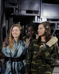 three young women standing next to each other