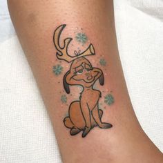 a tattoo on the leg of a person with a dog