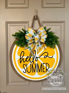 a door hanger that says, hello summer with a bow on it and an orange