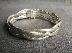 Beautiful matte silver bracelet, handmade, with four braided strips. Silver mark 835 and a silversmith's mark, see photos. Secure lock, see photos. Diameter 6.2 cm Length 18.8 cm Wide 1.4 cm Bali Jewelry, Wedding Jewelry Bracelets, Bracelet Handmade, Wedding Bracelet, Netherlands, Wedding Jewelry, Silver Bracelet, Braids, Bracelet