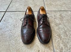 Here is a vintage pair of long wing shoes (model # 97626) by "Florsheim" for their "Royal Imperial" line. They are a size 8.5 D, but please use the measurements provided to ensure a proper fit. Made in the USA of 100% shell cordovan leather, their color is a staple dark brown. CONDITION: Excellent vintage condition, with the only flaws being some staining to the insole and typical wear to the bottoms! MEASUREMENTS:  -Insole: a hair over 11" -Outsole: 12" -Width at widest point: 4.25" Shoes Model, Wing Shoes, Ivy League, Loafer Shoes, Loafers Men, Dark Brown, Made In Usa, Shoes Mens, Men's Shoes