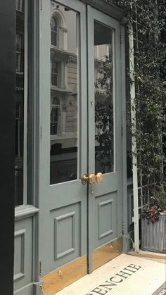 the front door of a building that has been painted blue