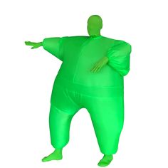 an inflatable green man is standing with his arms out and hands on his hips