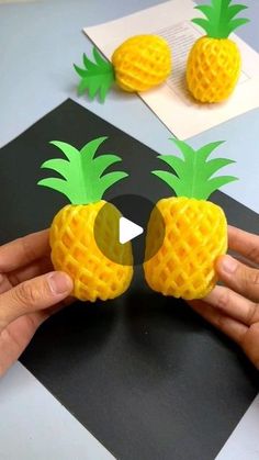 two pineapples made out of construction paper