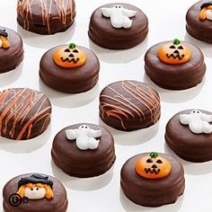 chocolate covered cookies decorated with halloween decorations