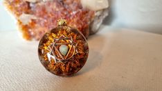 This orgonite necklace is made with healing stones special to solar plexus chakra. Sacred geometry form has been created with its unique wire winding technique and the effect area of its energy is increased. In addition to protection against the harmful effects of EMF, you can also use in Solar Plexus meditation. This Chakra its the source of your personal power and confidence. This enables you to discover who you truly are and let your authenticity flourish.  The solar plexus chakra helps grow Spiritual Healing Jewelry With Natural Inclusions, Chakra Pendant, Personal Power, Solar Plexus Chakra, Chakra Jewelry, Sacred Geometry, Healing Stones, Fire Opal, Colorful Pictures