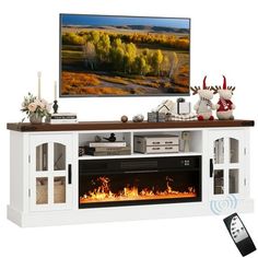 an entertainment center with a flat screen tv and fireplace