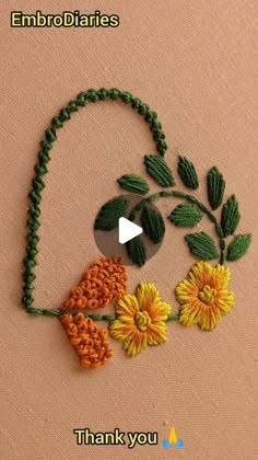 an embroidery project with flowers and leaves on the side of a piece of fabric that says, thank you