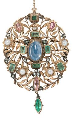 Arthur and Georgie Gaskin - An Arts and Crafts Gold Gem-set Pendant/Brooch, Circa 1909. Of floral and foliate motifs, bezel-set with foil-backed sapphires, pink gemstones, and a sapphire, with single-cut diamond and seed pearl accents, reverse with floral decoration, unsigned, 3 in. This piece is believed to be part of a larger necklace presented by the Lord Mayor of Birmingham to Queen Alexandra upon her visit to the city in 1909. Movement Jewelry, Antique Objects, Floral Brooch, Pink Gemstones, Gold Jewelry Fashion, Gold Flowers