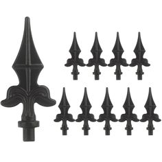 black wrought iron fence posts and post caps with fleur de lice designs on them