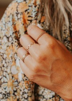 A ring that's as ZANY as you are. 1mm round wire is hand-shaped—each one is unique! Available in 14kt Gold Fill + Sterling Silver. Jess pairs it with our Teeny-Tiny Band, Confetti Ring and Dani Chain Ring. Jess B. styles it with our Cigar Band, Nellie Ring and Supermoon Ring. Our jewelry is handmade so each piece will be unique and may vary slightly from what is pictured. Modern Twist 14k Gold Midi Rings For Everyday, Everyday Modern Twist 14k Gold Midi Rings, Dainty Adjustable 14k Gold Filled Stackable Rings, Adjustable Dainty Stackable Rings In 14k Gold Filled, Adjustable 14k Gold Filled Stackable Rings, Adjustable Dainty 14k Gold Filled Stackable Rings, Confetti Ring, Everyday Wear Jewelry, Hoop Charms