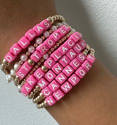 Say hello to our brand-new Destination Bracelets. These babies are all about fun and flaunting, dipped in hot pink color that's impossible to miss. Each bracelet rocks the names of our top-pick city spots and resort destinations.
This bracelets will not tarnish and you can wear this in the pool or sea.
3mm beads | Available in 6.5" or 9.5" (stretchy)
Please note that each piece is custom made with your city names and final sale. Adjustable Pink Bracelets With Letter Beads, Pink Letter Beads Name Bracelet, Custom Name Pink Jewelry For Everyday, Pink Stackable Beaded Bracelets For Summer, Stackable Pink Beaded Bracelets For Summer, Everyday Pink Custom Name Jewelry, Custom Name Pink Adjustable Bracelets, Pink Custom Name Adjustable Bracelet, Custom Name Adjustable Pink Bracelet