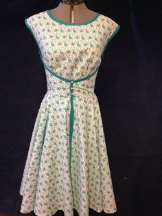 This dress is a 1952 Wrap Dress I can custom make to fit your size. It is a turquoise color with matching ribbon wrapped around the entire dress. There will be three small vintage buttons added similar to the ones shown. This is a beautiful wrap dress - form fitting but flows over the hips. This material is broadclothe poly cotton blend and has the look of a Doris Day dress in her much loved movies from the 50's and early 60's. Have fun with this vintage inspired wrap dress. Vintage Sundresses, Apron Dress Pattern, 1950s Clothes, 1940s Dress Pattern, Vintage Wrap Dress, Wife Fashion, Wrap Dress Pattern, Charlotte's Web, Wrap Clothing