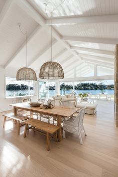 a dining table and bench in a large room