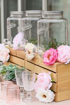 an instagram page with pink flowers and mason jars on the top of wooden crates