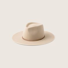 Inspired by the classic outback fedora with a simpler aesthetic. The Andy is our strongest statement piece yet, featuring a size adjustable sweatband designed to suit varied head sizes, a tall teardrop-shaped crown, a wide brim with a grosgrain binding to protect the brim edge. Made from stiffened cream Australian wool. Cream Hat, Baker Boy Cap, Hats Fashion, Hats Baseball, Wide Brim Fedora, Wool Fedora, The Blue Mountains, Bear Hat, Wool Beanie