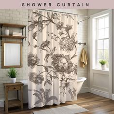 a shower curtain with flowers on it in a bathroom