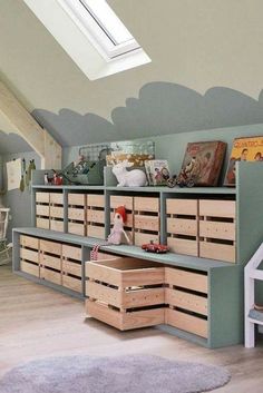 a child's room with lots of storage and toys