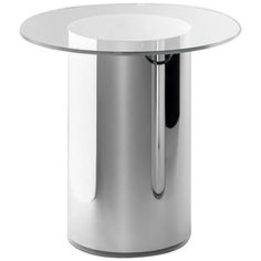 a round glass table with chrome legs