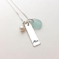 "Wave Necklace - Summer Jewelry Gift for Her - Seafoam Beach Glass Necklace - Sea Glass - Wave Jewelry - Beach Wedding - Bridesmaid Gift 1\" sterling silver hammered edge rectangle is stamped with a little wave. It is accented with a freshwater pearl and a piece of authentic, wave tumbled Lake Erie beach glass. The charms hang on a sterling silver box chain." Bridesmaid Gifts Beach Wedding, Beach Wedding Bridesmaids, Beach Wedding Jewelry, Beach Glass Necklace, Wave Jewelry, Wave Necklace, Glass Beach, Jewelry Beach, Etsy Bridesmaid Gifts