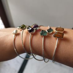 𝑯𝒂𝒏𝒅𝒎𝒂𝒅𝒆 𝒂𝒏𝒅 𝑴𝒊𝒏𝒊𝒎𝒂𝒍: Elevate your style and embrace the healing properties of nature with our exquisite collection of Raw Gemstone Bangle Bracelets. Handcrafted with love and care, these 925 silver bracelets are not only visually stunning but also carry the unique energy of each raw gemstone. 💜Raw Amethyst brings tranquility and spiritual awareness. 💚Raw Green Kyanite fosters a deep connection with nature and encourages a sense of balance and harmony.  🧡Raw Orange Kyanite i Adjustable Sterling Silver Bangle Jewelry, Adjustable Gemstone Cuff Bracelet For Anniversary, Stackable Sterling Silver Bangle Bracelets, Sterling Silver Stackable Bangle Bracelets, Adjustable Fusion Style Sterling Silver Bracelet For Gift, Fusion Style Gemstone Bangle Jewelry, Fusion Style Stackable Bangle Jewelry, Adjustable Sterling Silver Gemstone Jewelry, Adjustable Sterling Silver Jewelry With Gemstone