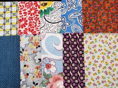 many different colored and patterned fabrics are arranged together