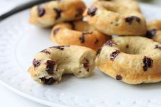 a white plate topped with chocolate chip bagels