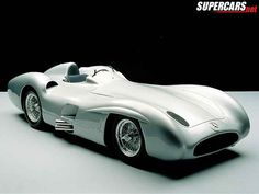 a silver sports car on a white surface