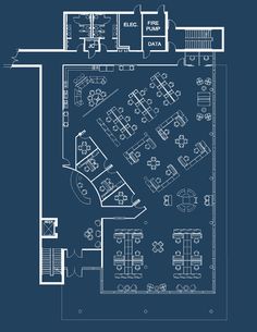 a blueprint drawing of an office with tables and chairs in the center, on a dark background