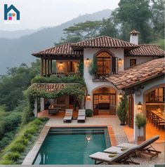 a house with a swimming pool in front of it and some chairs around the pool