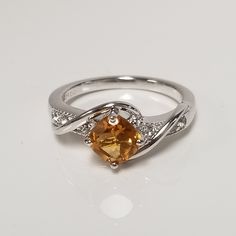 "Thanks for shopping our vintage estate store. We tend to sell well below wholesale and truly hope you enjoy all of our items. Many of the items are one of a kind, so please enjoy scrolling through the pictures and hopefully something will catch your eye. Brown spots from the camera or reflections. Estate sterling silver 925 copper honey 1ct citrine color stone ring. This a custom-made ring, meaning we added the gems into the setting. Ring size: 6.75 can be sized down for $20 Setting:  7mm 1/4\" Band width: 2mm Weight: 3.72 grams Beautiful ring. No scratches on the stone. Stone is testing as natural citrine, more than likely created, but not sure." Classic Amber Topaz Ring For Anniversary, Amber Topaz Birthstone Ring For Anniversary, Anniversary Orange Topaz Ring With Accent Stones, Classic Orange Topaz Ring For Anniversary, Vintage Topaz Ring With Polished Finish For Anniversary, Ring Meaning, Topaz Cocktail Ring, Color Stone Ring, Colored Stone Rings