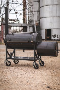 a large metal barrel sitting on top of a dolly