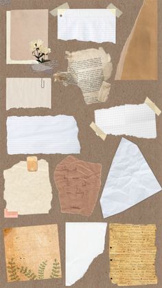 several pieces of torn paper and papers on a table