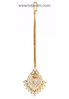 18 Karat Gold Diamond Maang Tikka with 22K Gold Chain - Papidi Billa 
  Diamond Weight: 1.45 Carats
  No. of Diamonds : 52 Diamonds
  Diamond Clarity : VVS Clarity Diamonds
  Diamond Color : E/F 

  Note : This item comes with IGI certificate    - 235-GT001 - in 7.900 Grams for USD $2159.99. 
Made in India by Totaram Jewelers Online this product is in Gold - 18 Karat Gold  & is an excellent gift for Adult - Women. Ships fully insured with secured guaranteed delivery for free with your order Elegant 22k Gold Tikka For Festivals, Elegant Yellow Gold Tikka For Diwali, Elegant Yellow Gold Tikka For Festivals, Elegant 22k Gold Tikka For Diwali, Formal Kundan Hand Set Tikka, Formal Kundan Tikka Hand Set, Diwali Rose Cut Diamond Jewelry, Festival Jewelry With Rose Cut Diamonds, Traditional Hand Set Cubic Zirconia Tikka